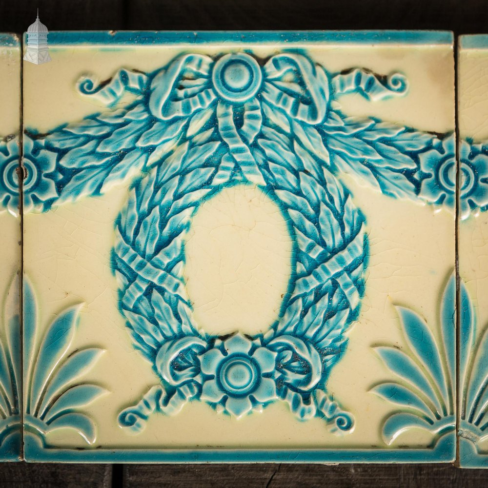 NR57021: Set of 10 Minton, Hollins & Co Blue Glazed Tiles with Bow and Wreath Design