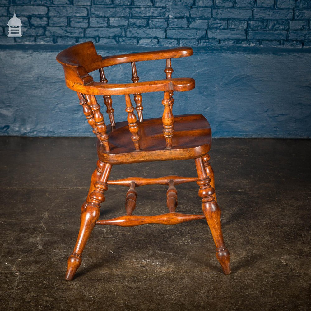 19th C Elm Captain’s Bow Seat Smokers Chair with Turned Arm Supports and Double H Stretcher
