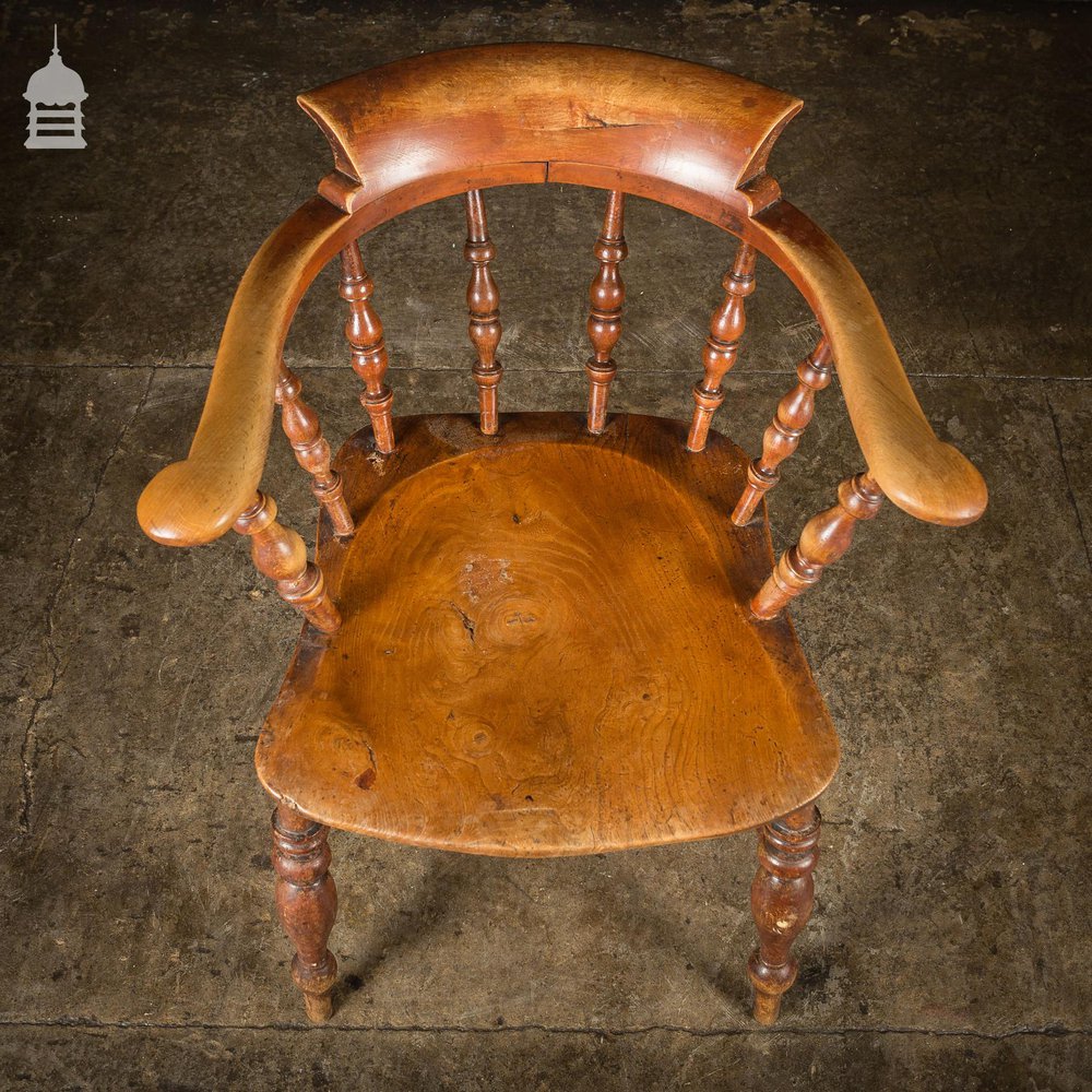 19th C Elm Captains Bow Seat Smokers Chair with Turned Arm Support and Double H Stretcher
