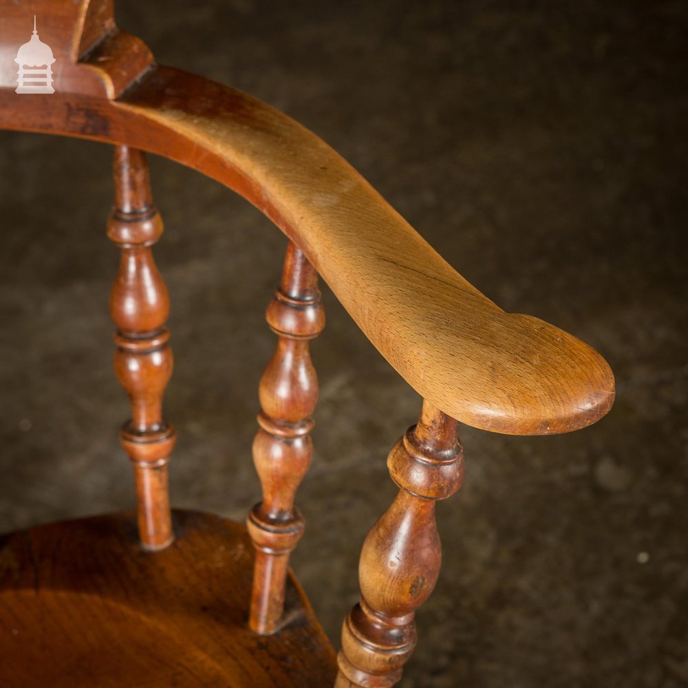 19th C Elm Captains Bow Seat Smokers Chair with Turned Arm Support and Double H Stretcher